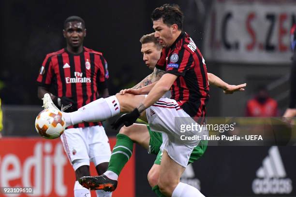 Alessio Romagnoli of AC Milan and Jakub Swierczok of Ludogorets Razgrad compete for the ball during UEFA Europa League Round of 32 match between AC...