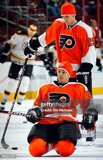 Daniel Briere and Matt Carle of the Philadelphia Flyers warm up before playing the Boston Bruins on October 22, 2009 at Wachovia Center in...