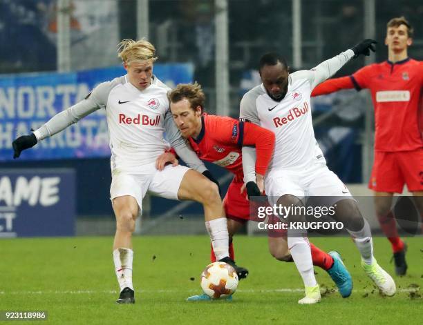 Real Sociedad's David Zurutuza Veillet vies with FC Red Bull Salzburg's Xaver Schlager Reinhold and Ray Yabo during the round of 32 UEFA Europa...