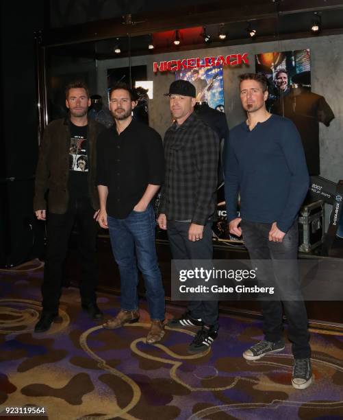 Frontman Chad Kroeger, guitarist Ryan Peake, bassist Mike Kroeger and drummer Daniel Adair of Nickelback attend a memorabilia case dedication ahead...