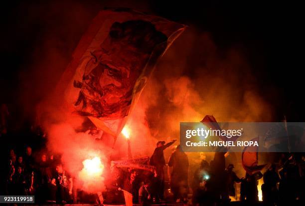 Marseille supporters light flares during the Europa League Round of 32 second leg football match between SC Braga and Olympique de Marseille at the...