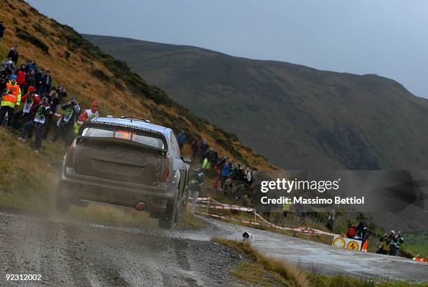 Mikko Hirvonen of Finland and Jarmo Lehtinen of Finland compete in their BP Abu Dhabi Ford Focus during Leg 1 of the WRC Wales Rally GB on October...