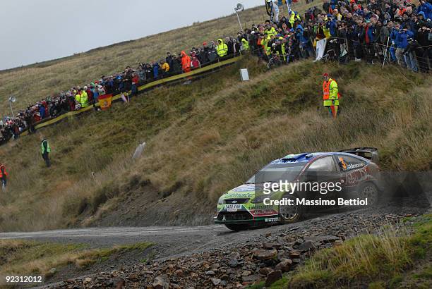 Mikko Hirvonen of Finland and Jarmo Lehtinen of Finland compete in their BP Abu Dhabi Ford Focus during Leg 1 of the WRC Wales Rally GB on October...