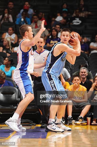 Spencer Nelson of the Utah Jazz looks to pass against Steve Novak of the Los Angeles Clippers during the preseason game on October 17, 2009 at...