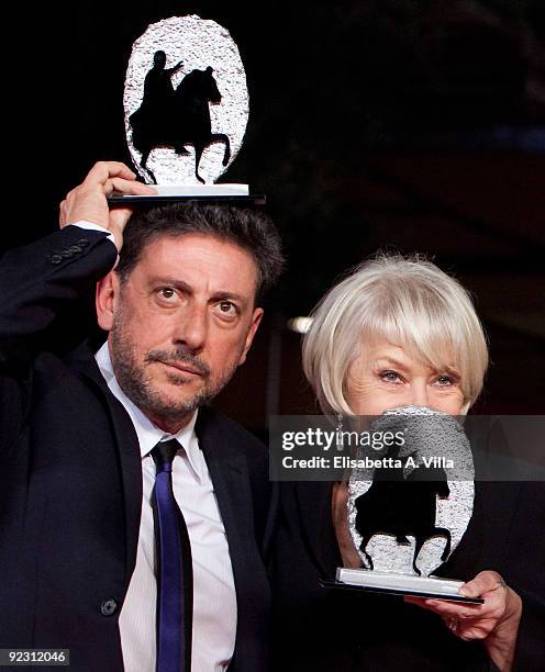 Actors Sergio Castellitto and Helen Mirren pose with their awards as they attend the Official Awards Photocall on Day 9 of the 4th International Rome...