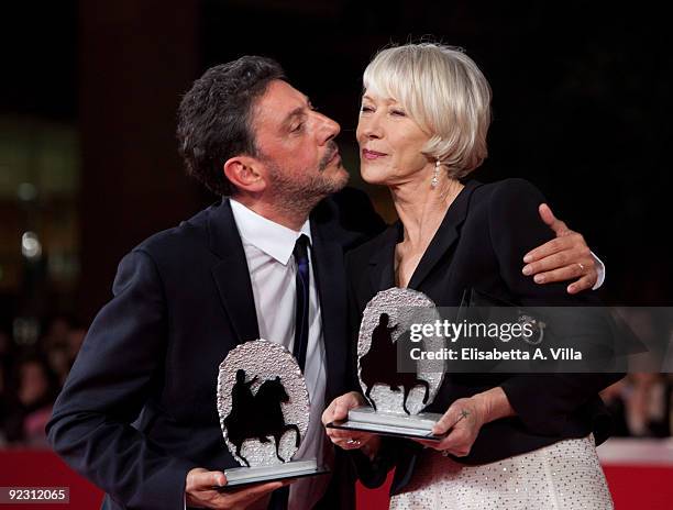 Actors Sergio Castellitto and Helen Mirren pose with their awards as they attend the Official Awards Photocall on Day 9 of the 4th International Rome...