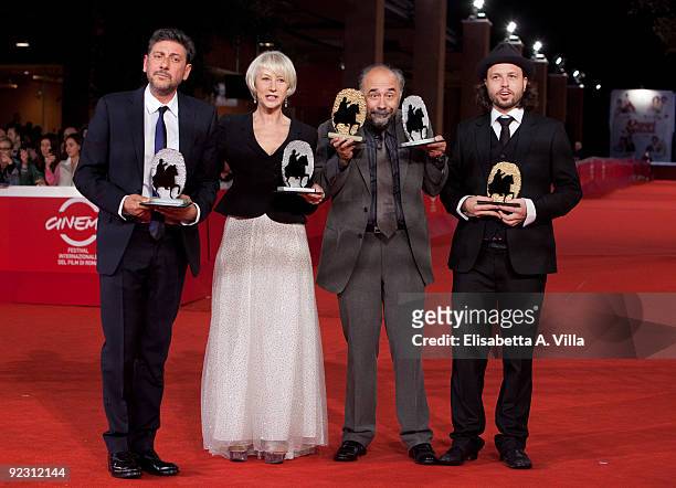Actor Sergio Castellitto, actress Helen Mirren, director Giorgio Diritti and director Nicolo Donato pose with their awards as they attend the...