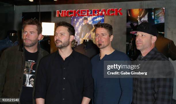 Frontman Chad Kroeger, guitarist Ryan Peake, drummer Daniel Adair and bassist Mike Kroeger of Nickelback attend a memorabilia case dedication ahead...