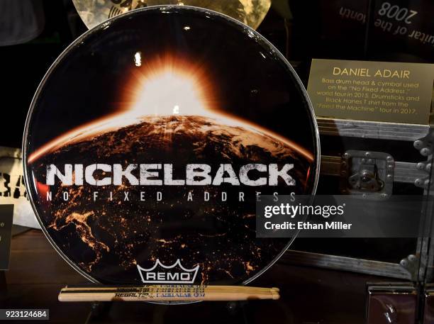 Nickelback drummer Daniel Adair's bass drum head is displayed in a memorabilia case after it was unveiled ahead of the band's five-night "Feed the...