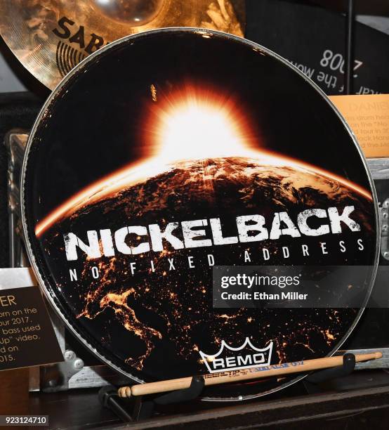 Nickelback drummer Daniel Adair's bass drum head is displayed in a memorabilia case after it was unveiled ahead of the band's five-night "Feed the...