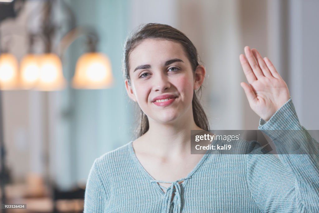 Teenage Girl Saying Hello In Sign Language High Res Stock Photo Getty teenage-girl-saying-hello-in-sign-language-high-res-stock-photo-getty