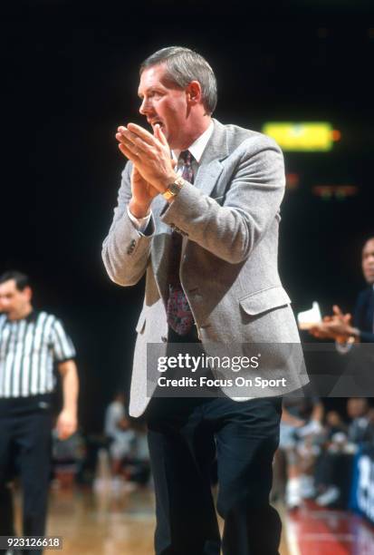 Head coach Jim O'Brien of the Boston College Eagles looks on against the Georgetown Hoyas during an NCAA College basketball game circa 1991 at the...