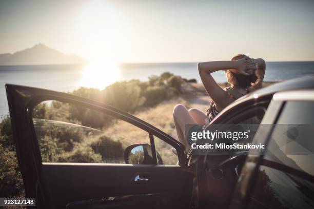 woman on the road trip - adventure stock pictures, royalty-free photos & images