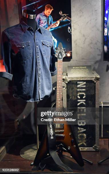 Nickelback guitarist Ryan Peake's Gibson Flying V guitar and Levi's shirt are displayed in a memorabilia case after it was unveiled ahead of the...