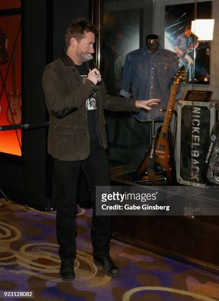 Frontman Chad Kroeger of Nickelback speaks about items in the memorabilia case after it was unveiled ahead of the band's five-night "Feed the...