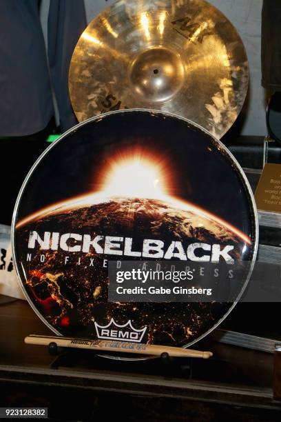 Nickelback drummer Daniel Adair's bass drum head and cymbal are displayed in a memorabilia case after it was unveiled ahead of the band's five-night...