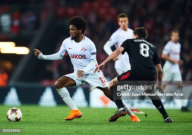 Luiz Adriano of FC Spartak Moskva being followed by Ander Iturraspe of Athletic Club during UEFA Europa League Round of 32 match between Athletic...