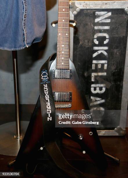 Nickelback guitarist Ryan Peake's Gibson Flying V guitar is displayed in a memorabilia case after it was unveiled ahead of the band's five-night...