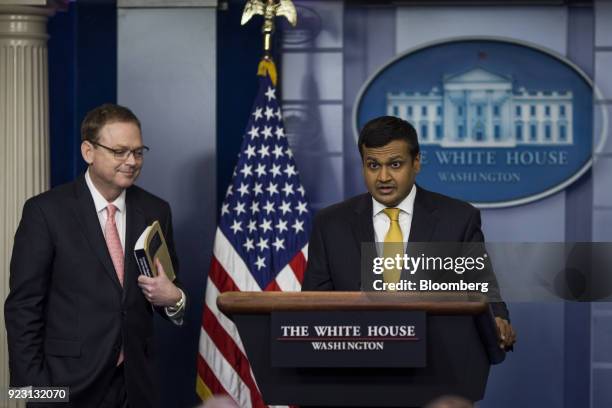Raj Shah, White House deputy press secretary, speaks while Kevin Hassett, chairman of the Council of Economic Advisors , left, listens during a White...