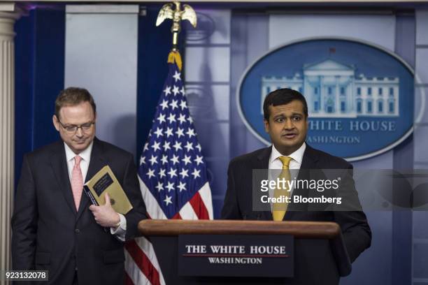 Raj Shah, White House deputy press secretary, speaks while Kevin Hassett, chairman of the Council of Economic Advisors , left, listens during a White...