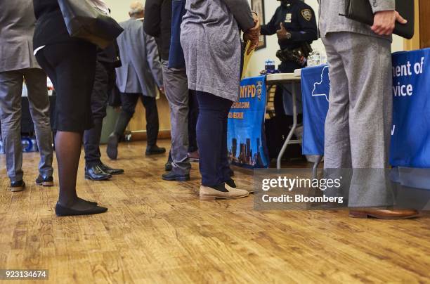 Job seekers wait in line to speak with representative during a Shades of Commerce Career Fair in the Brooklyn borough of New York, U.S., on Saturday,...