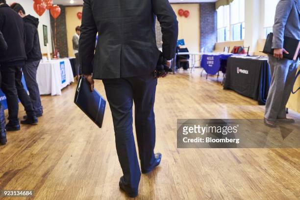 Job seeker arrives for a Shades of Commerce Career Fair in the Brooklyn borough of New York, U.S., on Saturday, Feb. 17, 2018. The latest initial...