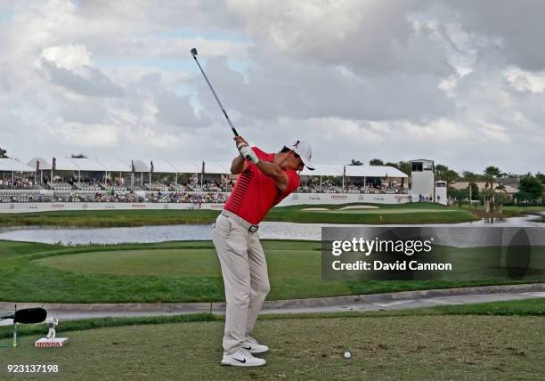 Rory McIlroy of the Northern Ireland plays his tee shot on the par 3, 17th hole with a long iron during the first round of the 2018 Honda Classic on...