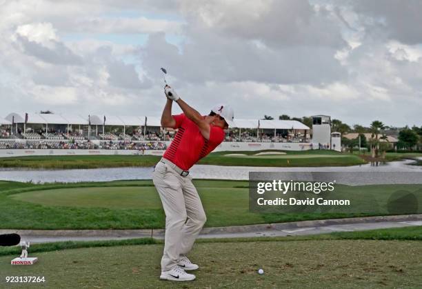 Rory McIlroy of the Northern Ireland plays his tee shot on the par 3, 17th hole with a long iron during the first round of the 2018 Honda Classic on...