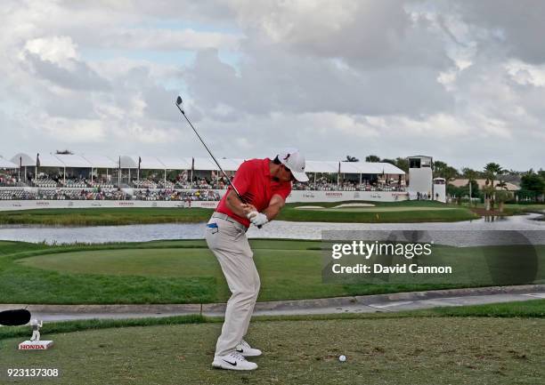 Rory McIlroy of the Northern Ireland plays his tee shot on the par 3, 17th hole with a long iron during the first round of the 2018 Honda Classic on...