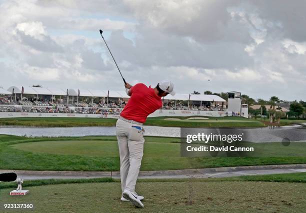 Rory McIlroy of the Northern Ireland plays his tee shot on the par 3, 17th hole with a long iron during the first round of the 2018 Honda Classic on...