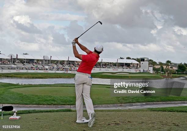 Rory McIlroy of the Northern Ireland plays his tee shot on the par 3, 17th hole with a long iron during the first round of the 2018 Honda Classic on...