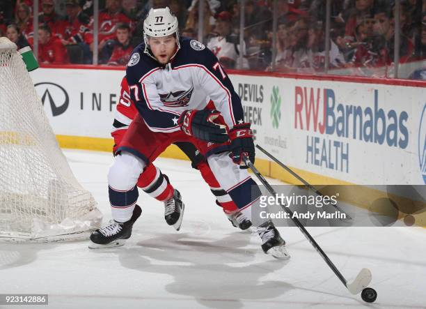 Josh Anderson of the Columbus Blue Jackets plays the puck during the game against the New Jersey Devils at Prudential Center on February 20, 2018 in...