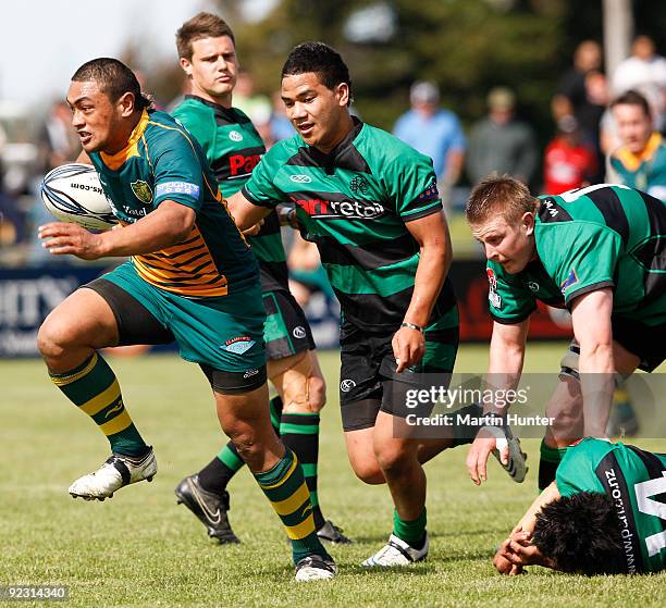 Jack Umaga of Mid Canterbury breaks through the tackle of Tevita Latu of South Canterbury during the Heartland Championship Semi-Final match between...