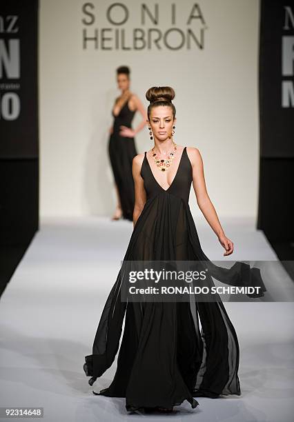 Model displays a creation by Colombian designer Sonia Heilbron during the Mercedes Benz Fashion Week in Mexico City on October 23, 2009. AFP...