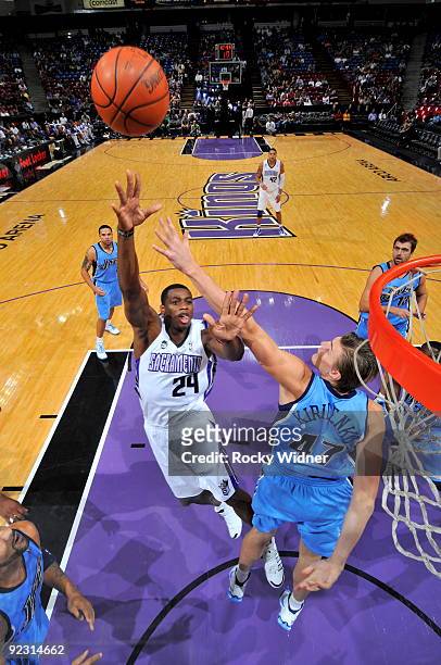 Desmond Mason of the Sacramento Kings takes the ball to the basket against Andrei Kirilenko of the Utah Jazz during a preseason game on October 23,...