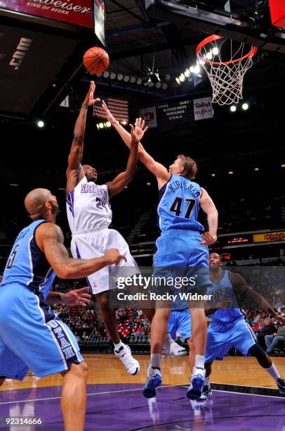 Desmond Mason of the Sacramento Kings shoots the ball over Andrei Kirilenko of the Utah Jazz during a preseason game on October 23, 2009 at ARCO...