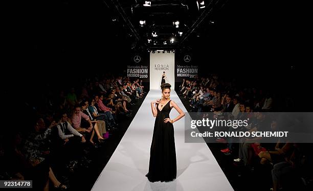 Model displays a creation by Colombian designer Sonia Heilbron during the Mercedes Benz Fashion Week in Mexico City on October 23, 2009. AFP...