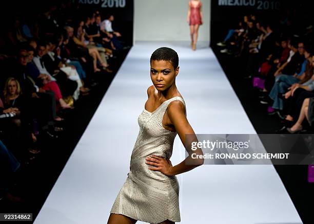 Model displays a creation by Colombian designer Sonia Heilbron during the Mercedes Benz Fashion Week in Mexico City on October 23, 2009. AFP...