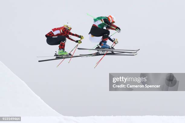 Talina Gantenbein of Switzerland and Marielle Thompson of Canada compete during the Freestyle Skiing Ladies' Ski Cross 1/8 Finals on day fourteen of...