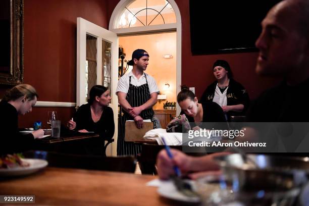Sous chefs Ben Ashworth and Becka Bogue update front house staff about the evening specials and other kitchen happenings before evening service at...