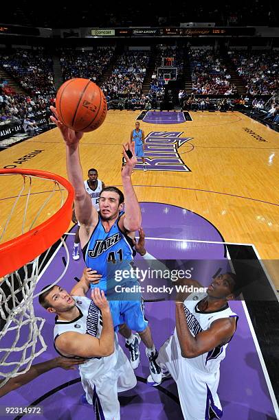 Kosta Koufos of the Utah Jazz takes the ball to the basket against the Sacramento Kings during a preseason game on October 23, 2009 at ARCO Arena in...