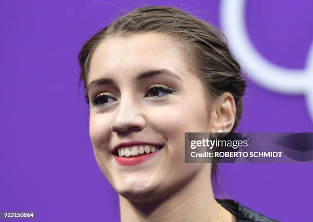 Switzerland's Alexia Paganini looks on after competing in the women's single skating free skating of the figure skating event during the Pyeongchang...