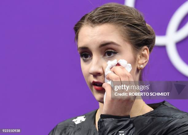 Switzerland's Alexia Paganini looks on after competing in the women's single skating free skating of the figure skating event during the Pyeongchang...