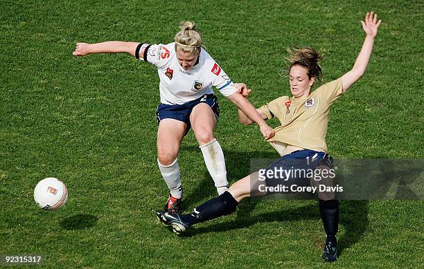 Cailtlin Cooper of the Mariners is challenged by Emma Stewart of the Jets during the round four W-League match between the Newcastle Jets and the...