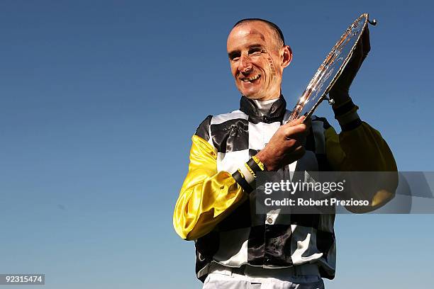 Glen Boss celebrates with the Cox Plate after riding So You Think to victory in the Tatts Cox Plate during the 2009 Cox Plate Day meeting at Moonee...