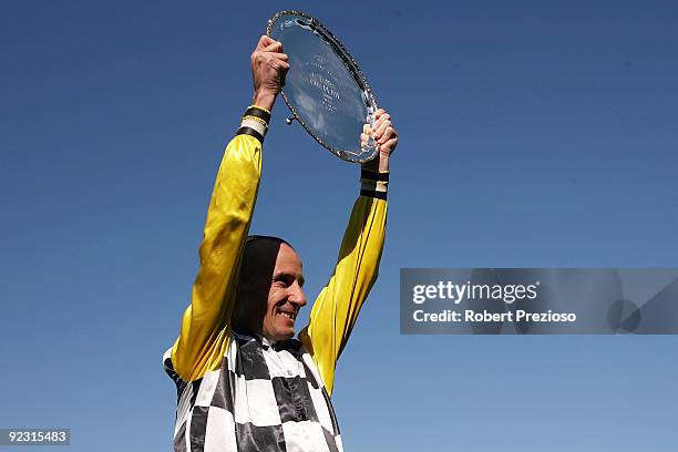 Glen Boss celebrates with the Cox Plate after riding So You Think to victory in the Tatts Cox Plate during the 2009 Cox Plate Day meeting at Moonee...