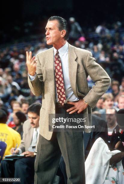 Head Coach Pat Riley of the Miami Heat looks on against the Washington Bullets during an NBA basketball game circa 1995 at US Airways Arena in...