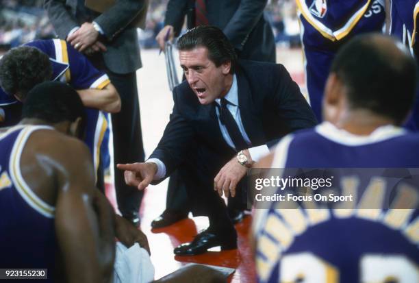 Head Coach Pat Riley of the Los Angeles Lakers talks with his team while there's a time out during an NBA basketball game circa 1985. Riley coached...