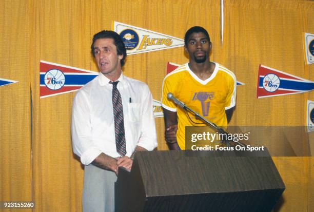 Head Coach Pat Riley and Magic Johnson of the Los Angeles Lakers talks to the media after an NBA basketball game circa 1982 at The Forum in...