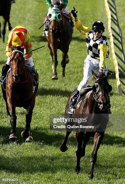 Glen Boss riding So You Think celebrates as he crosses the line to win the Tatts Cox Plate during the 2009 Cox Plate Day meeting at Moonee Valley...